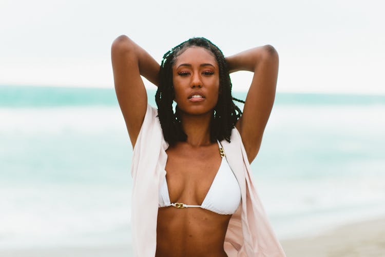 Woman Wearing Bikini On Sea Shore