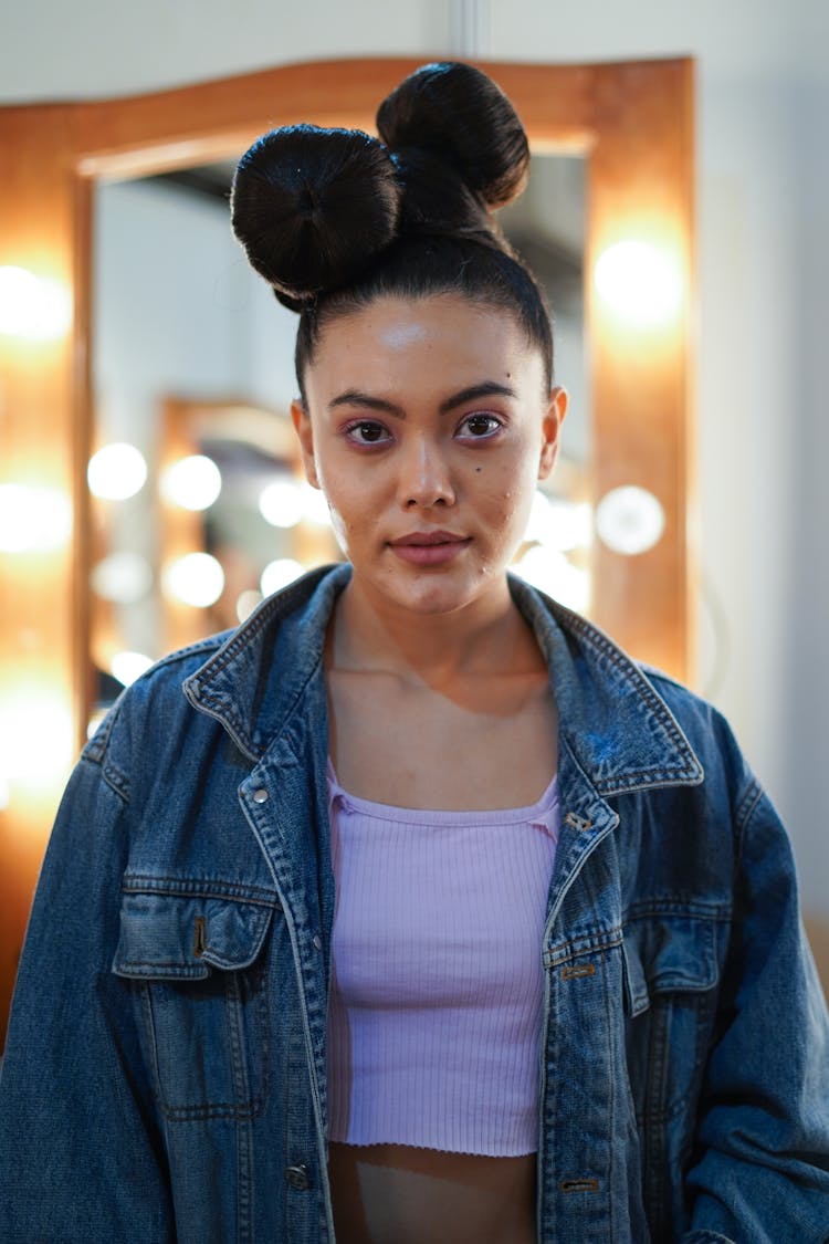 Trendy Ethnic Woman With Bow Hairstyle In Denim Jacket