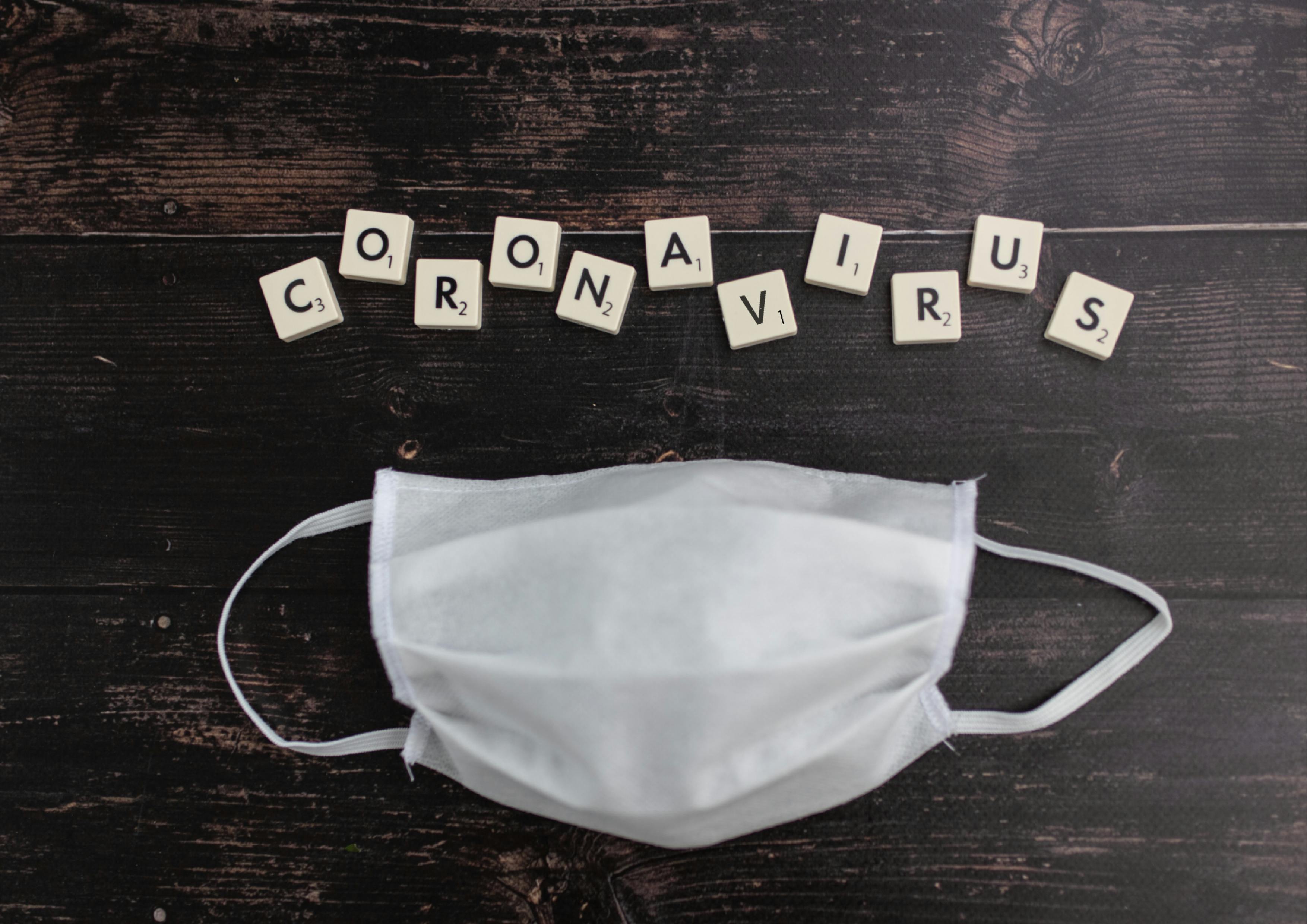 cubes with letters and sterile mask for covid