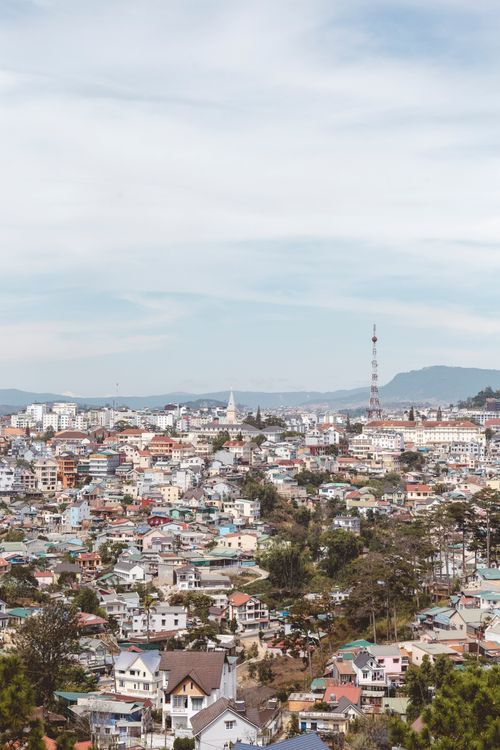 Free Aerial view of the cityscape in Dalat, showcasing diverse architecture against a clear sky. Stock Photo