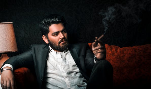 Confident man in a suit smoking a cigar, exuding sophistication and style.