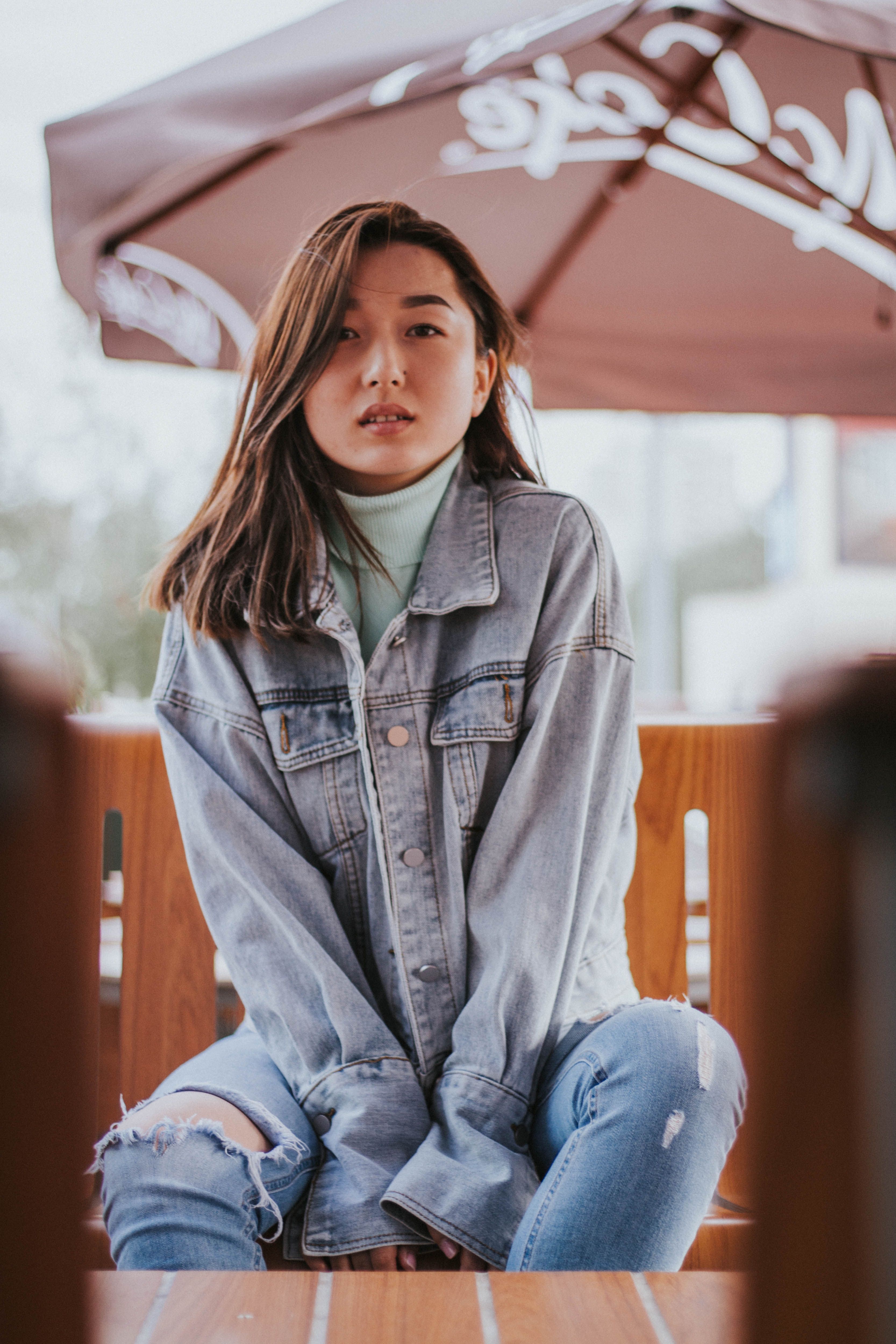 Woman in denim jacket and jeans