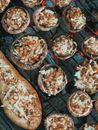From above delicious homemade stuffed mushrooms and eggplant under layer of cheese roasting on barbecue grill
