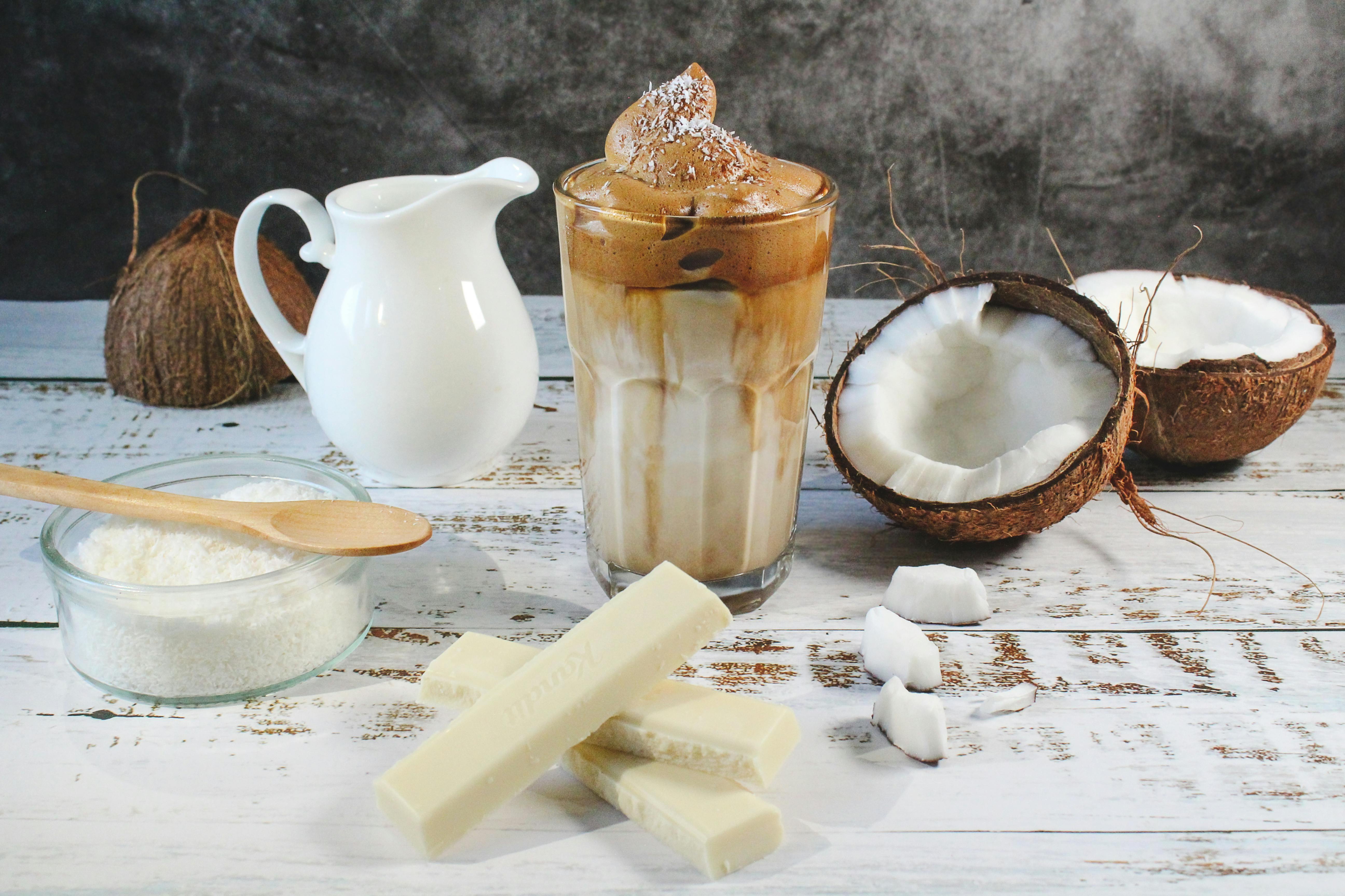 coffee cocktails with flavored coffee - Delicious iced coffee with coconut and white chocolate on rustic table.