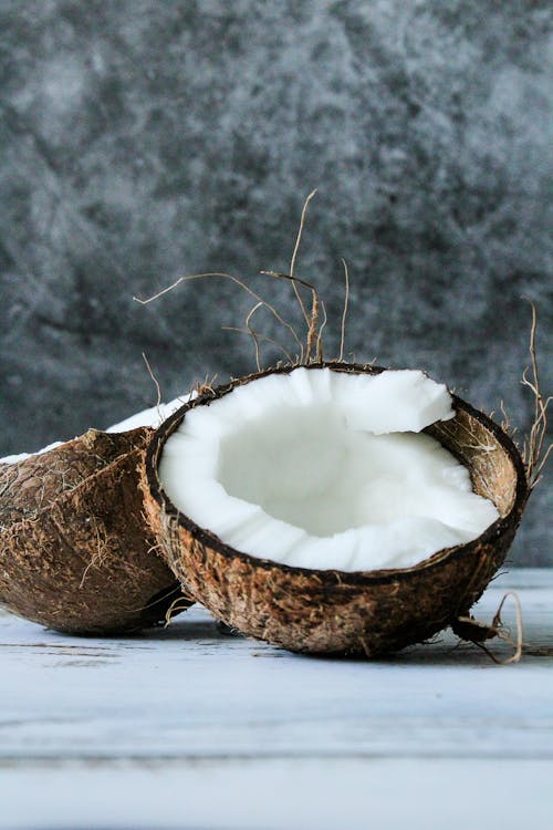 Free Close-Up Photo of a Halved Coconut Stock Photo
