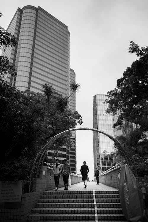 Free People Walking Across Bridge Stock Photo