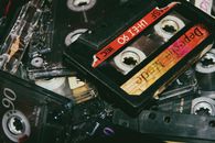 Collection of vintage audio cassettes on table