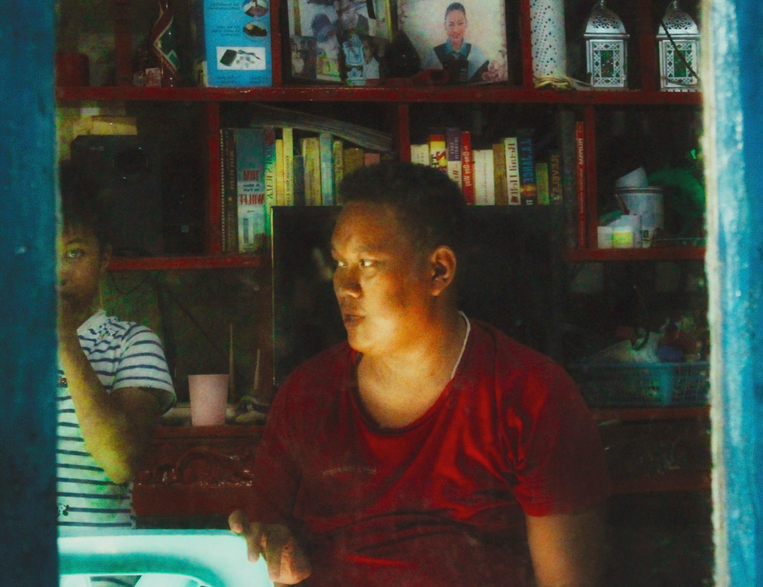 A cozy garden retreat with a fire pit, chairs, and a table