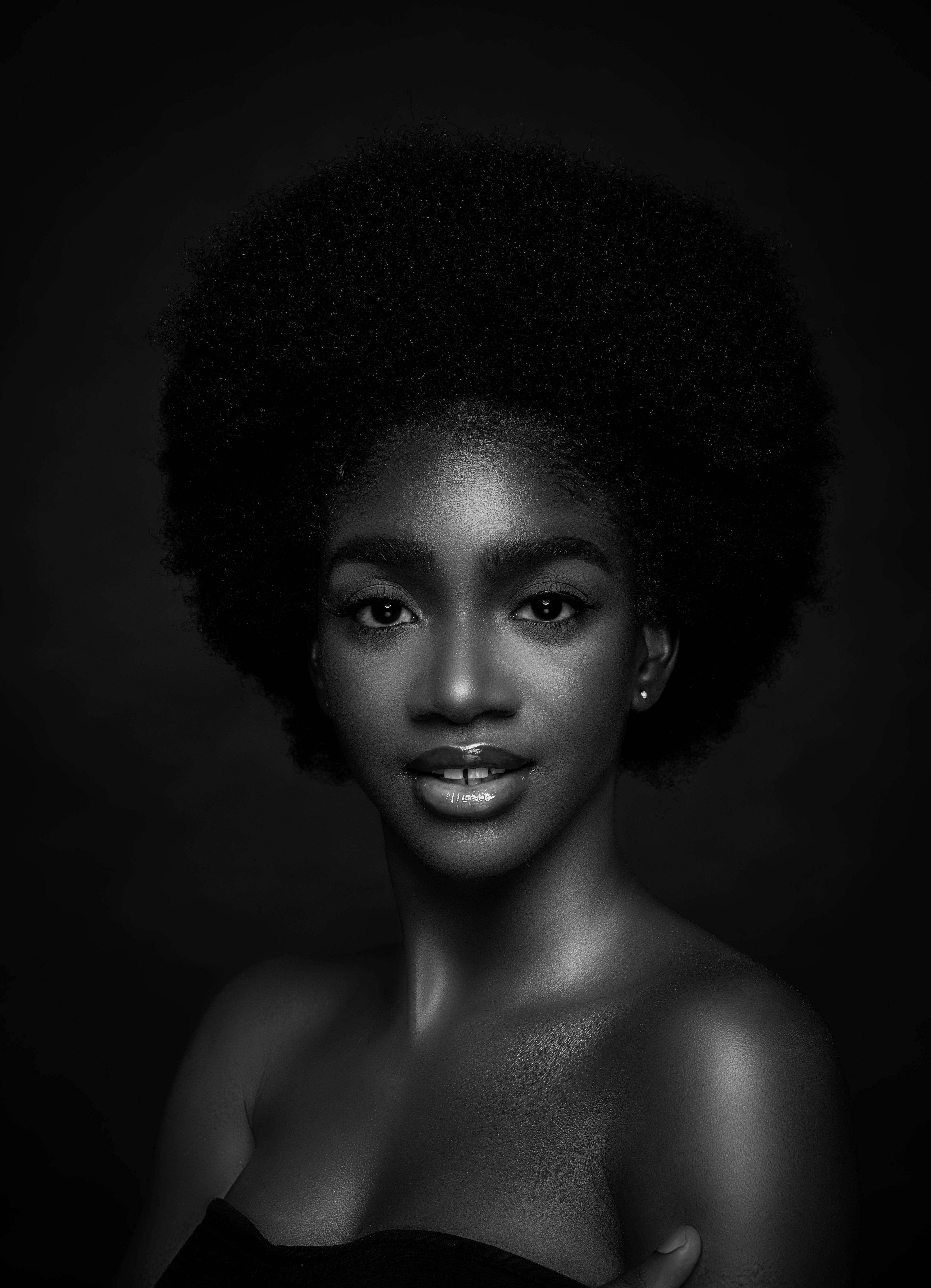 Fashion Woman in New York. Young African American Woman with long hair  dressing in red slim