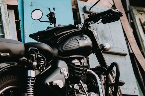 Free Close-up of a classic Royal Enfield motorcycle parked outdoors in Coimbatore, India. Stock Photo