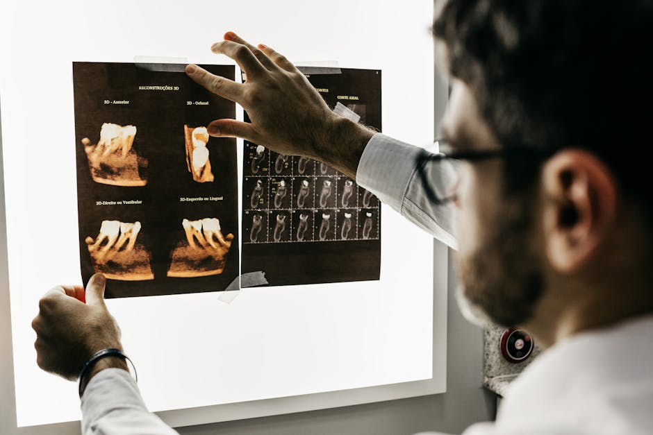 Man Looking at Teeth X-rays