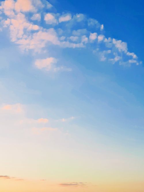 Free Serene view of Berlin's colorful sky at sunrise, showcasing warm hues and scattered clouds. Stock Photo