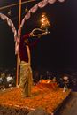 Man in Red Long Sleeve Shirt Holding a Burning Oil Lamp