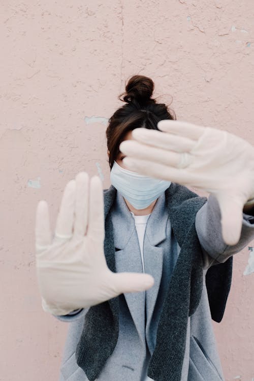 Woman With Face Mask and Latex Gloves 
