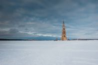 Neoclassical flooded belfry on snowy terrain