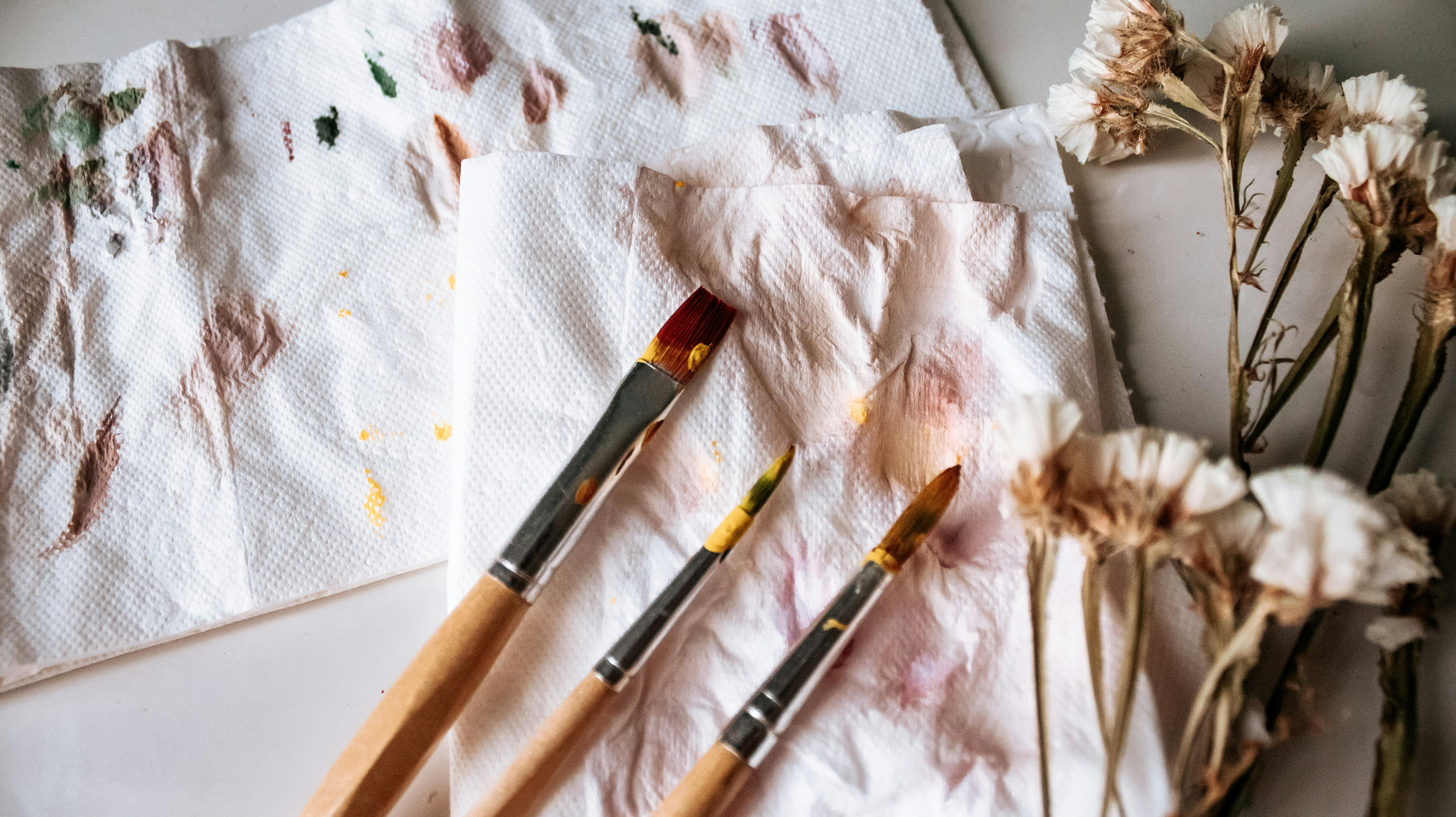 A white table topped with paint and brushes. Paint brushes painting. -  PICRYL - Public Domain Media Search Engine Public Domain Image