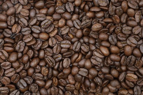 Free High-quality close-up image of roasted coffee beans, perfect for backgrounds. Stock Photo