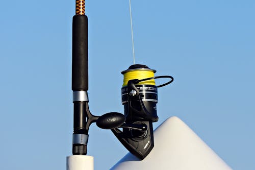 Fishing rod with line placed in boat