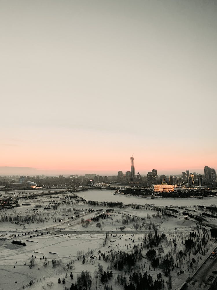 Snowy City Park And Modern Towers