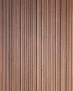 Overhead of textured backdrop representing brown ploughed meadow with vertical lines in countryside in daylight