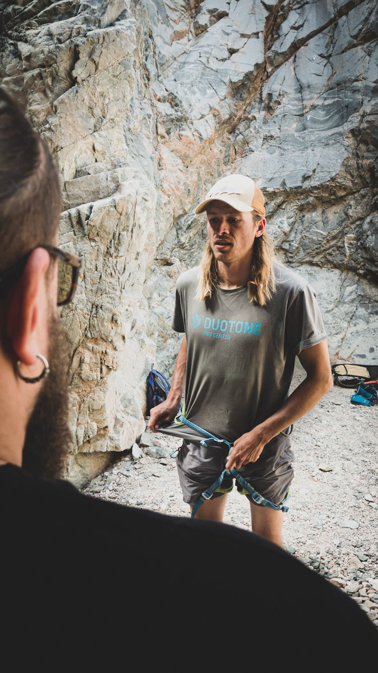 Fit Male Climber With Crop Instructor In Mountains