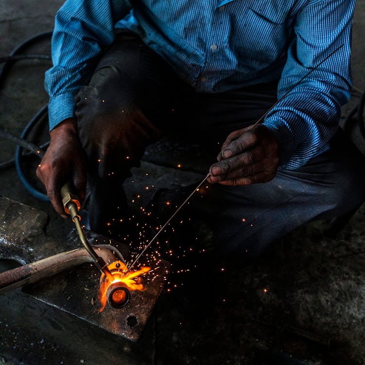 Crop Welder Welding Steel Pipe At Work