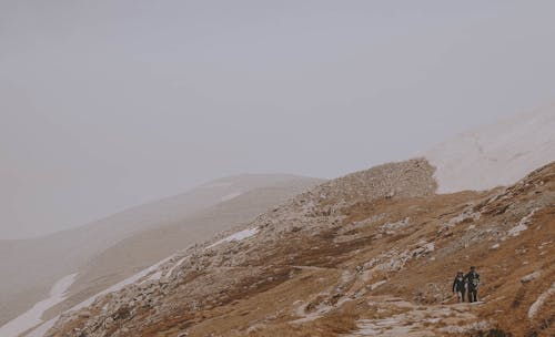 Free People Hiking on a Mountain Stock Photo