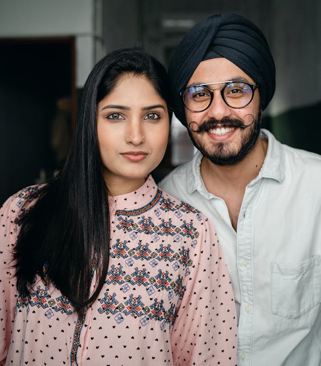 Happy Indian couple looking at camera