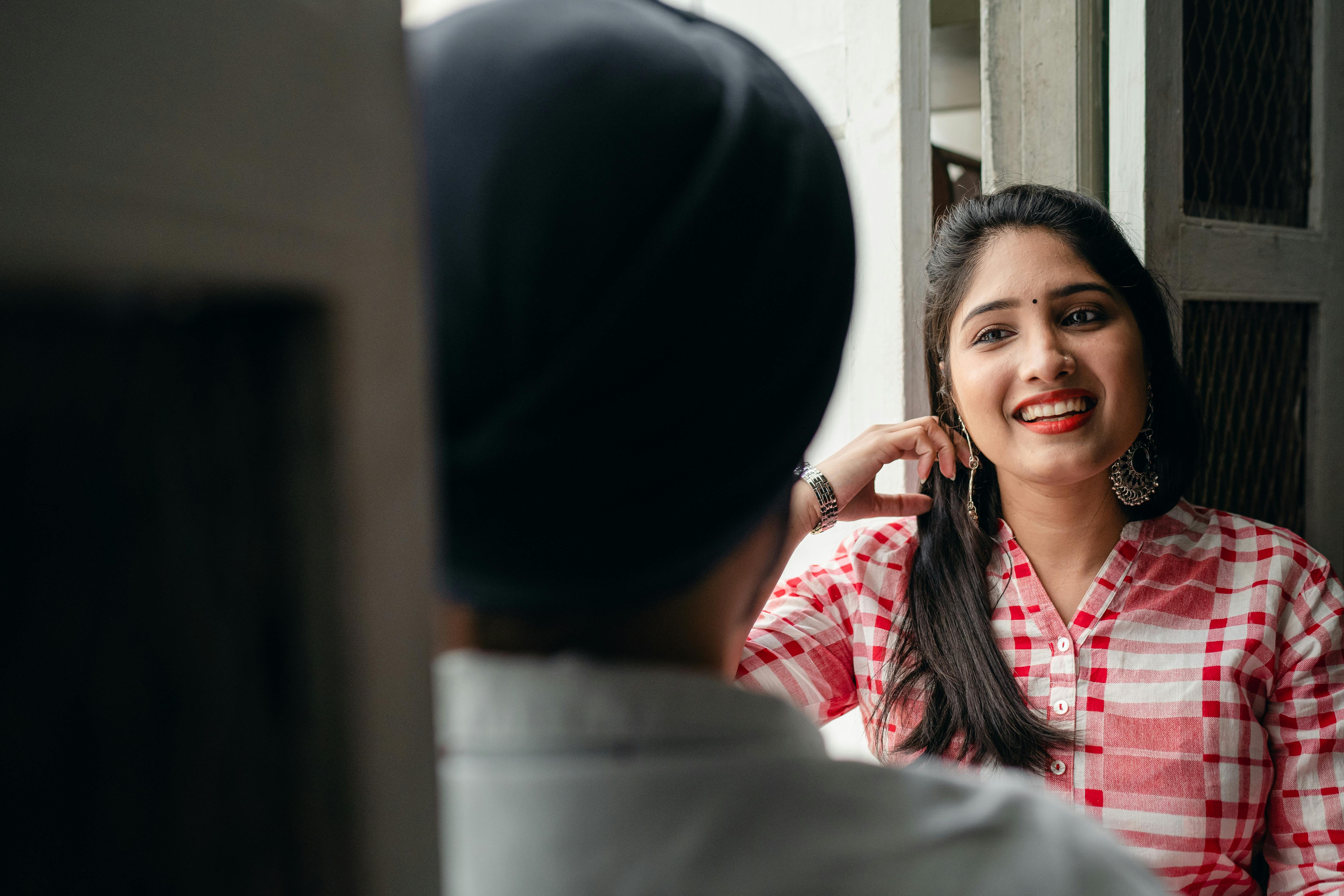 young lady listening to man with interest and smiling