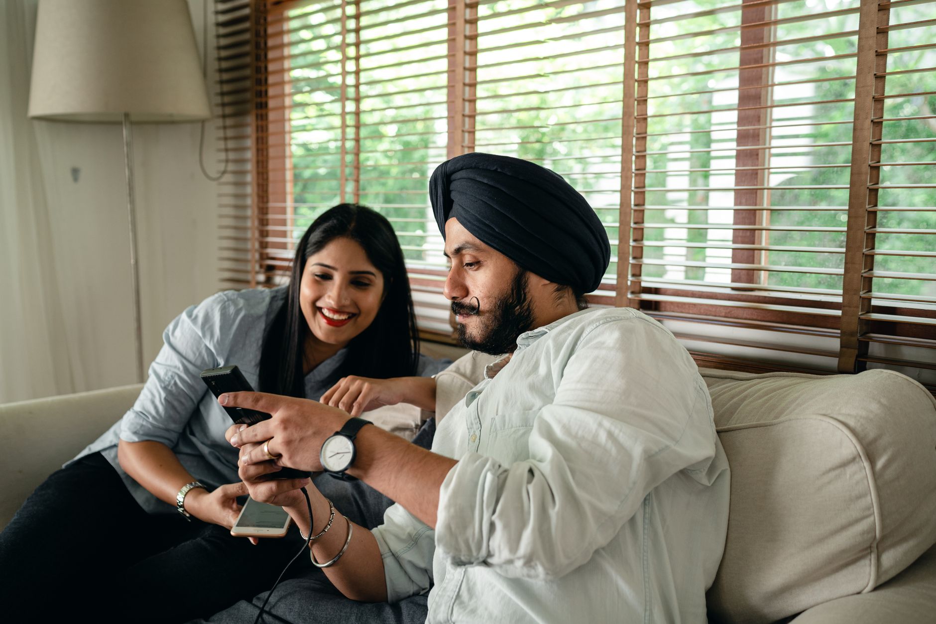 JioHotstar content grid showing Indian dramas, Disney films and sports tiles on a large smart television