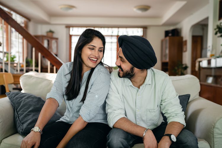 Loving Young Indian Couple Flirting And Smiling At Home