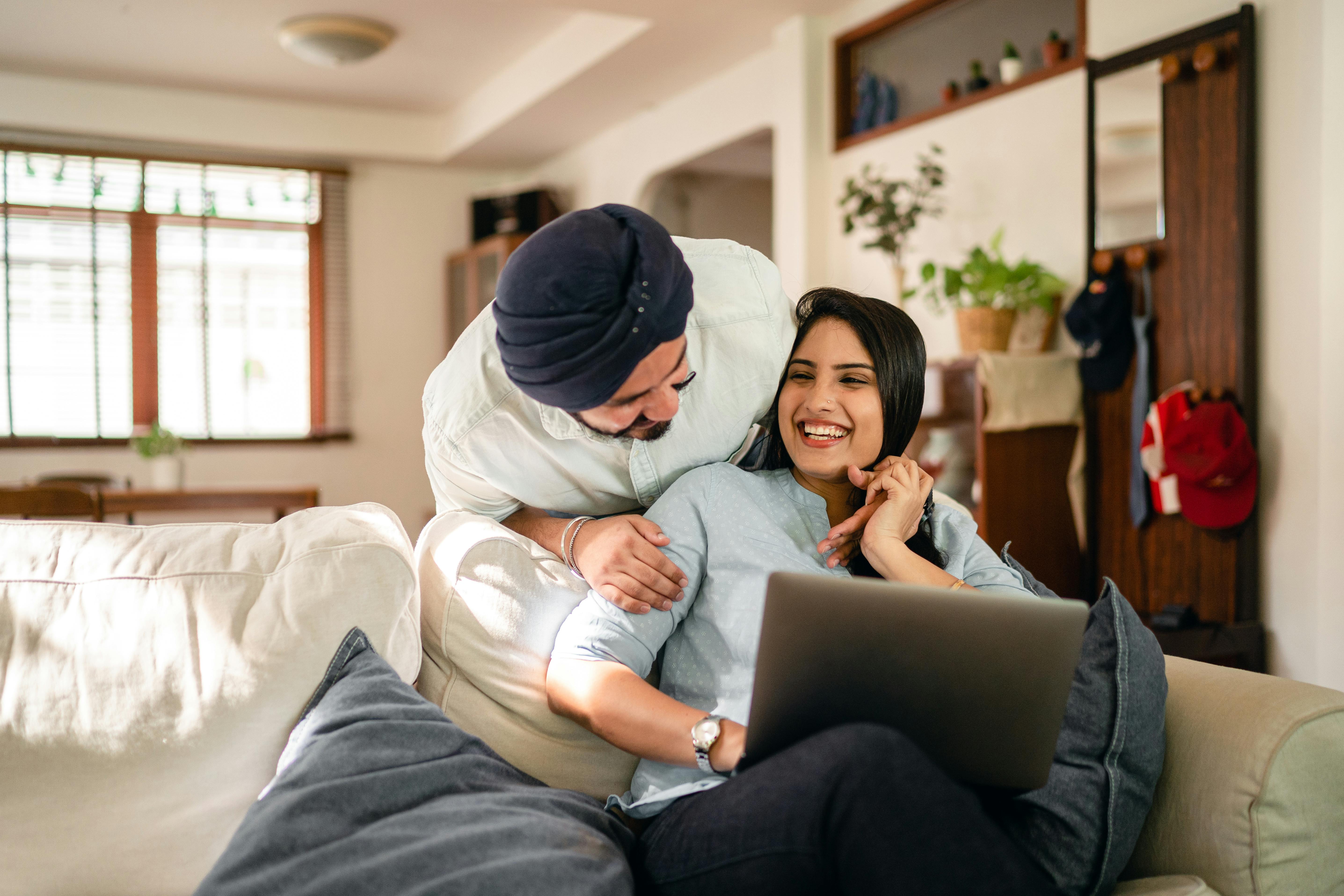 ethnic couple having fun at home