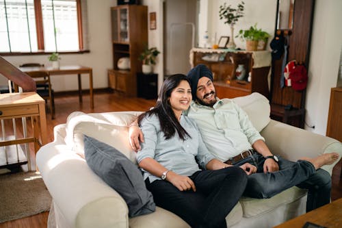 Happy ethnic couple enjoying time together at home