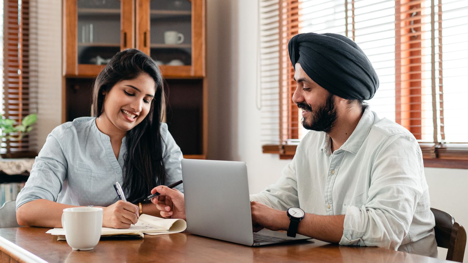 Indian professionals collaborating on a marketing strategy in an office.