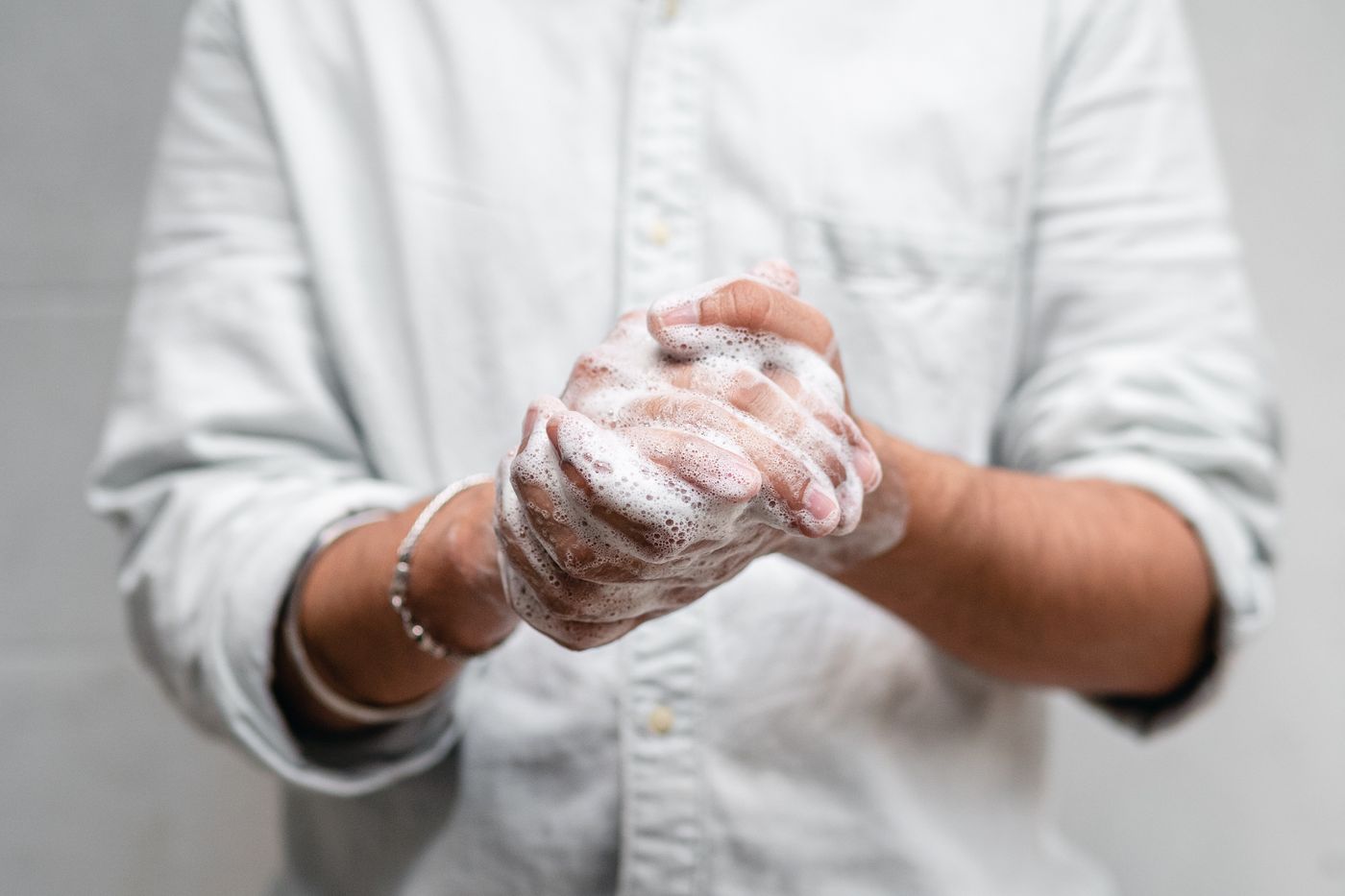 Hands being washed with soap