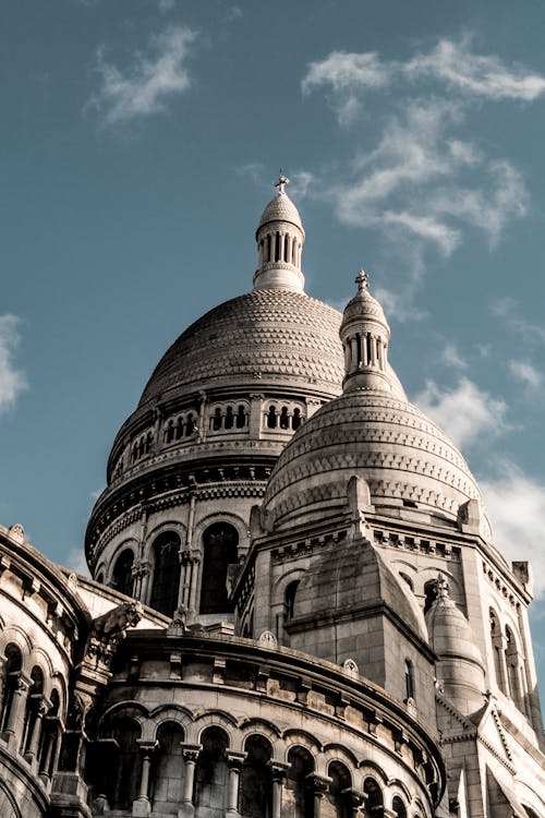 Medieval building with domes against cloudy sky