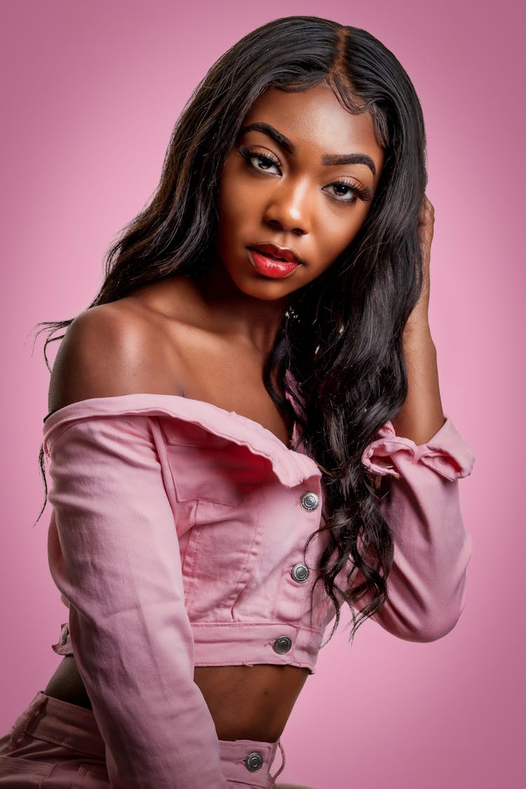 A Woman Wearing A Pink Off Shoulder