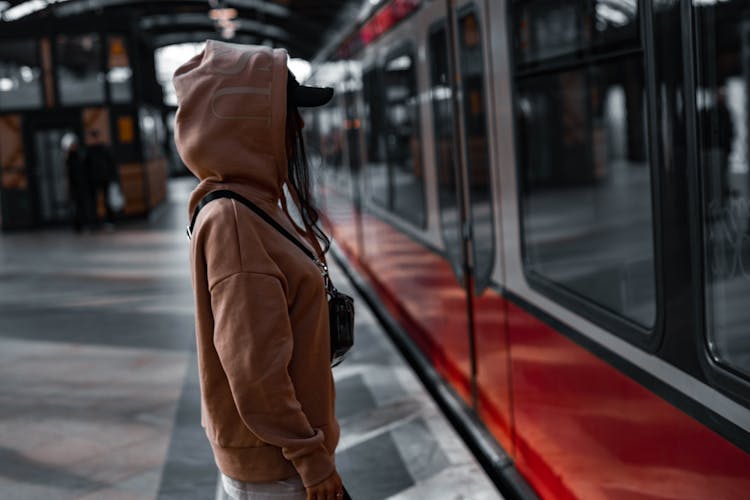 A Woman In Brown Hoodie