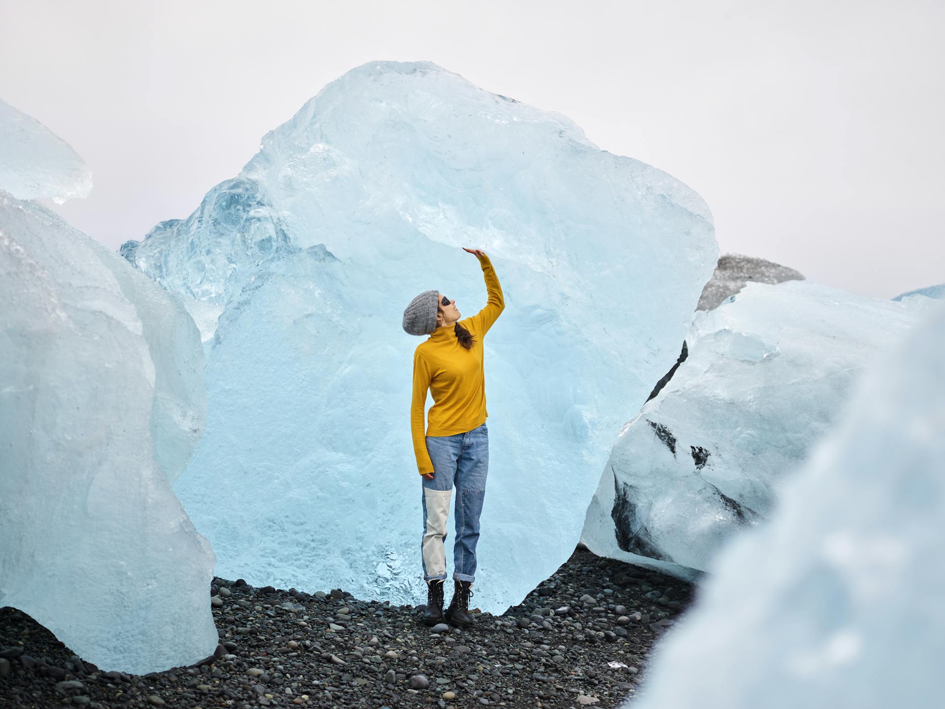Woman admiring view of gigantic ice chunks