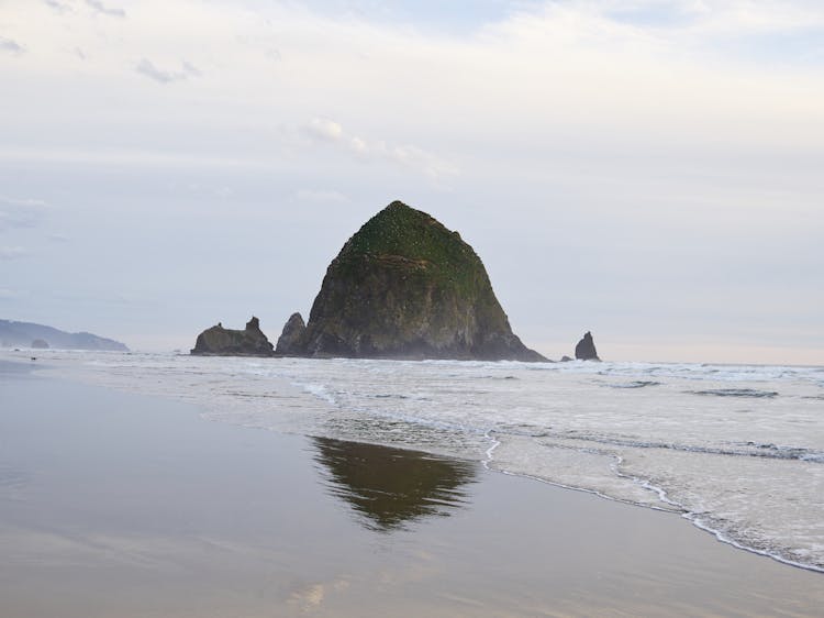 Empty Sandy Ocean Beach And Haystack Rock