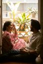 Young boyfriend and girlfriend enjoying time at home together