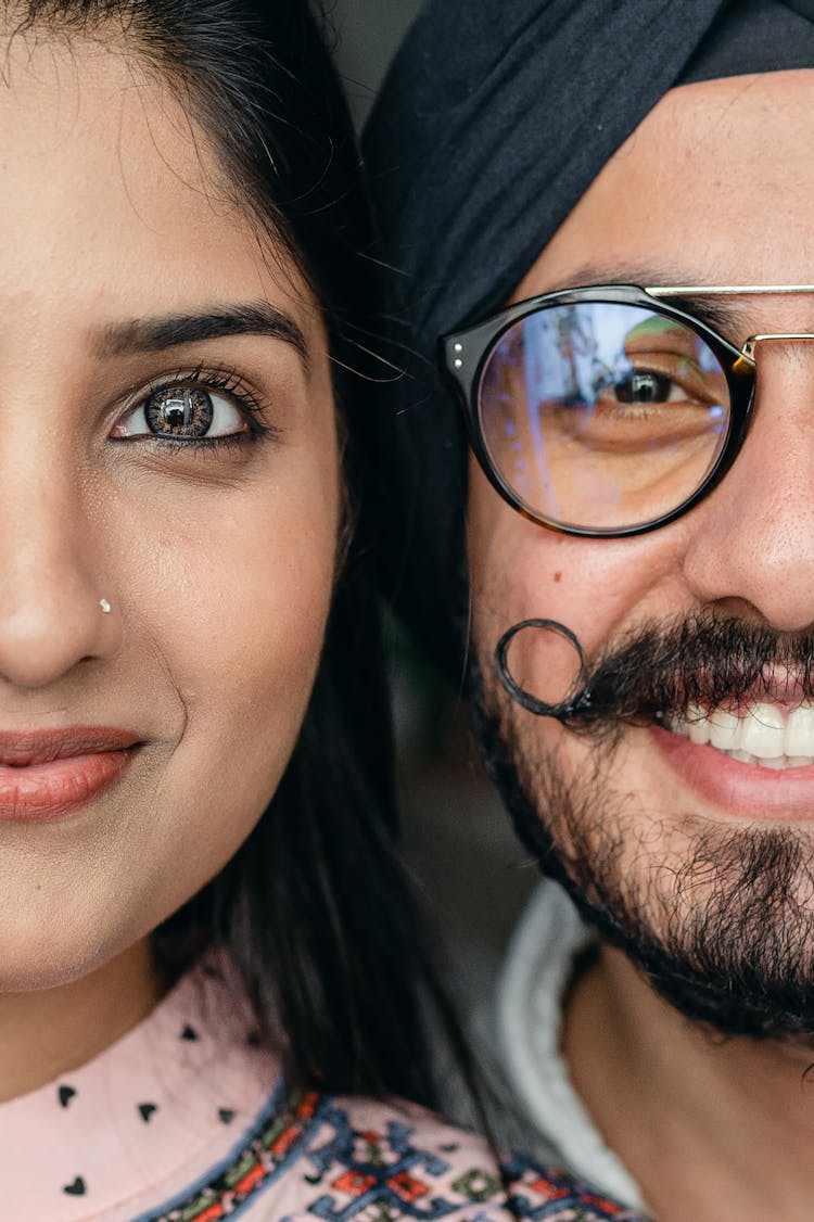 Happy Young Indian Couple Looking At Camera