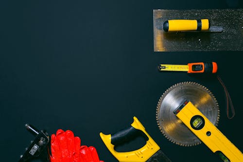Free Red and Yellow Hand Tools on the Table Stock Photo