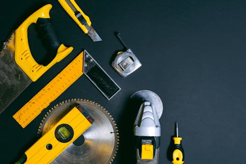 Free Yellow and Black Hand Tools on the Table Stock Photo