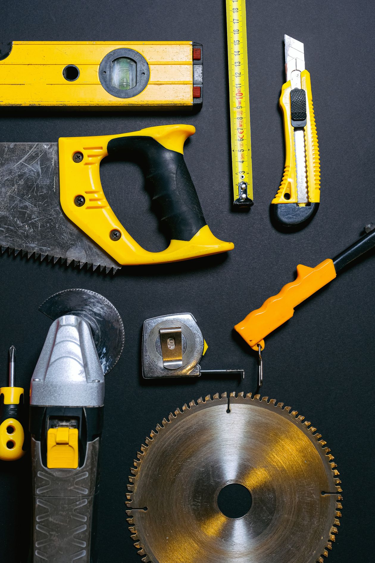 Construction hand tools laid out on a table