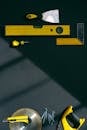 Yellow and Black Hand Tools on the Table