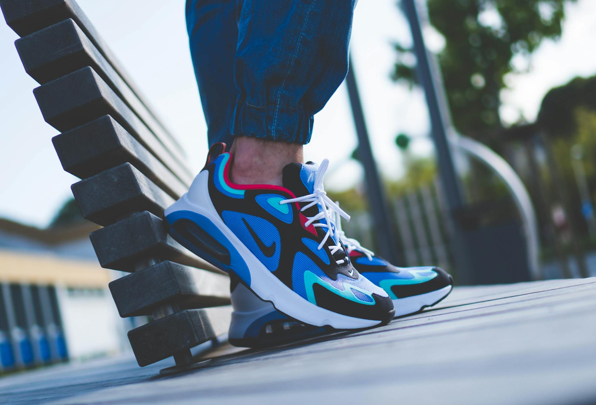 Vibrant Nike sneakers in a casual outdoor setting, capturing urban style and comfort.