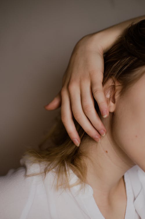 Tender woman with birthmark on neck