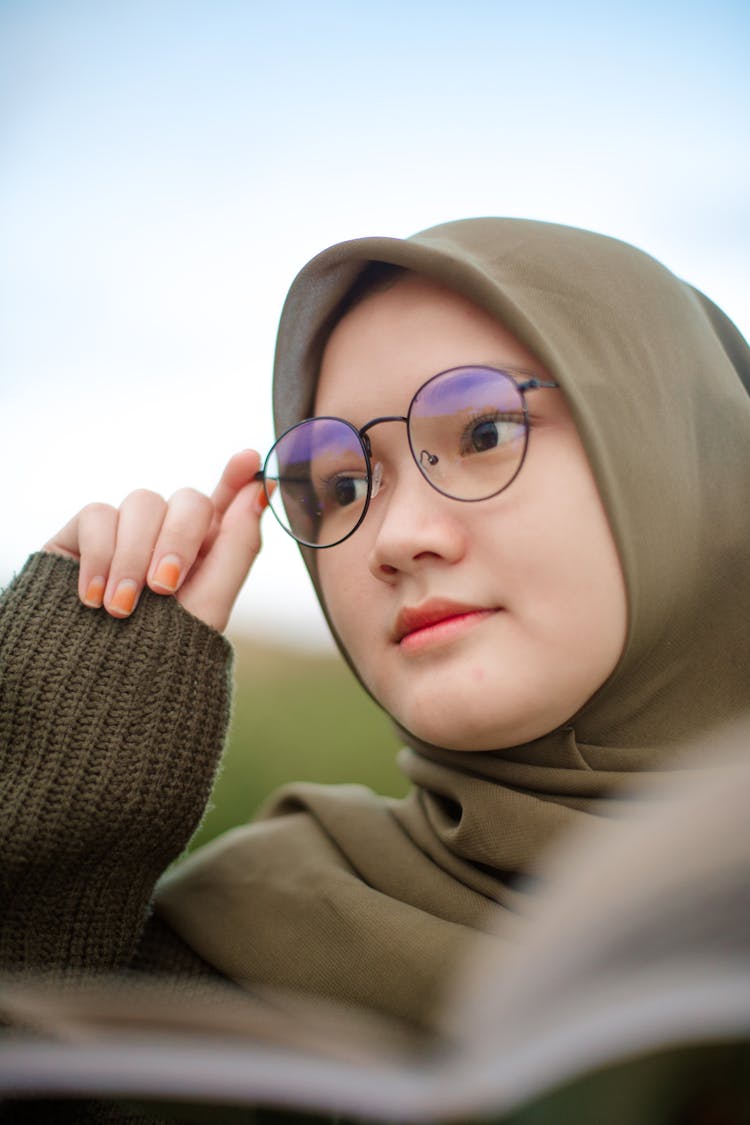 Young Ethnic Teen Female In Trendy Glasses