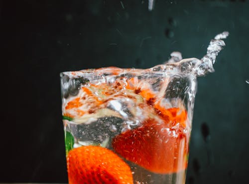 Free Strawberries Floating in a Glass with Drinks Stock Photo